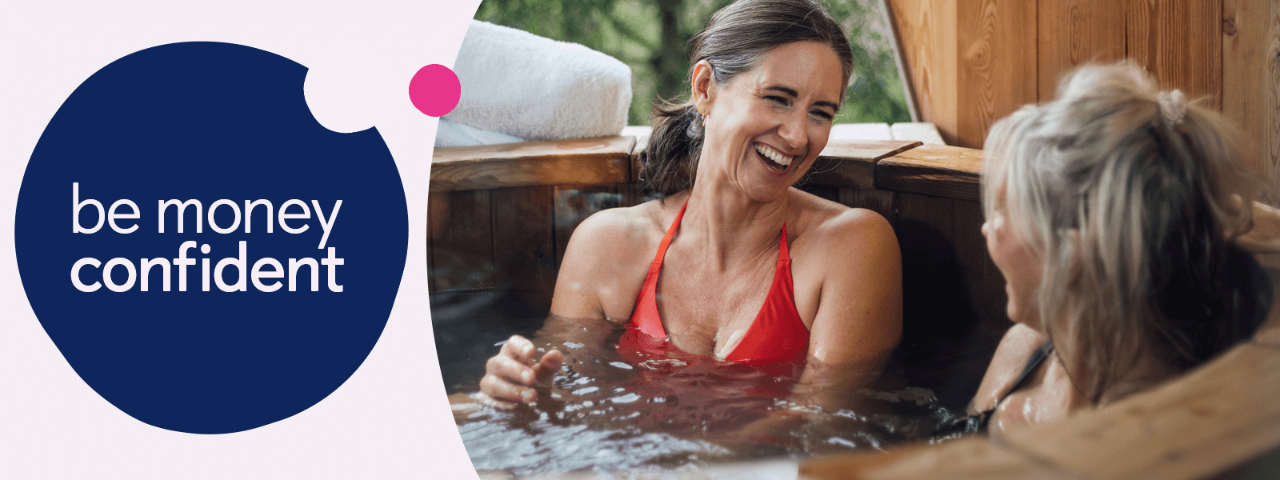 Two women sat in a spa laughing
