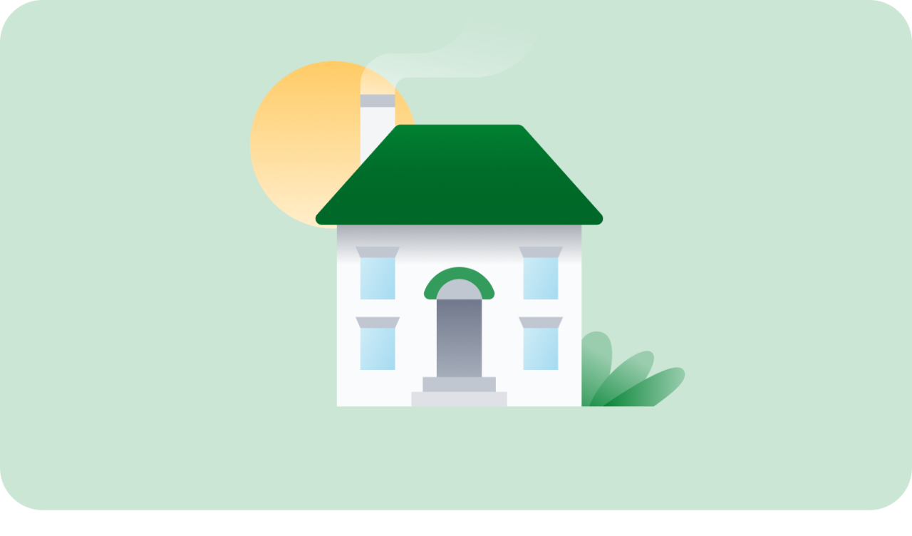 The sun behind a white house with a green roof and bushes.